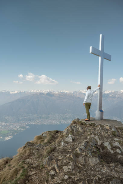 istock Hiker male contemplates view from mountain top 1316215811