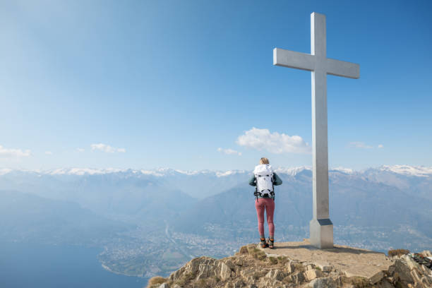 istock Hiker female contemplates view from mountain top 1316215945