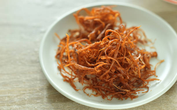 istock Crispy dried shredded pork on white background. 1316216481
