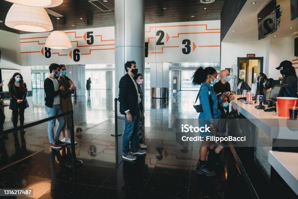 People Are Waiting In Line At The Movie Theaters Bar Stock Photo - Download Image Now