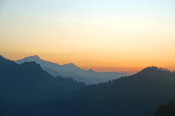 Photo of Landscape Nature Silhouette scene and sunrise on Mt. Annapurna  mountain in the Annapurna Himalayas seen from Poon Hill, Nepal - trekking route to Poon Hill - Morning Sky