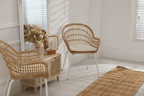 istock Living room interior with wooden commode, mirror and wicker chairs 1316219478