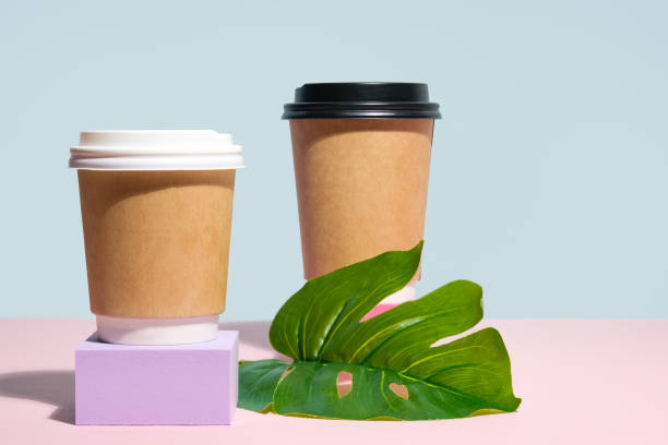 istock Two containers for hot drinks on colourful podiums 1316220663
