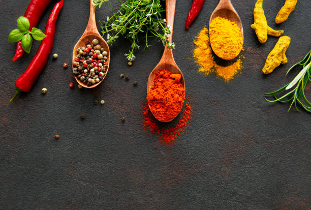 istock Various spices spoons on stone table. Top view with copy space 1316220822
