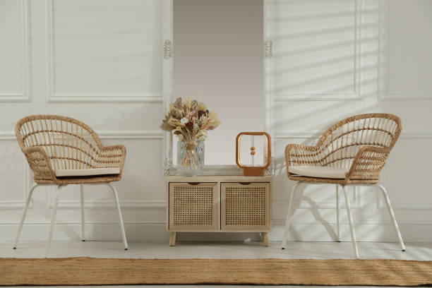 istock Living room interior with wooden commode, mirror and wicker chairs 1316222076