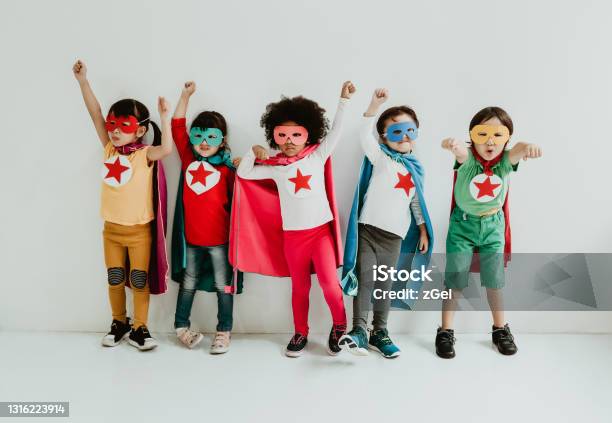 Group Of Diverse Children Playing Superhero On The White Wall Background Superhero Concept Happy Time Stock Photo - Download Image Now