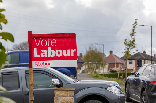 Sheffield, South Yorkshire, England - May 1 2021: A red and white sign for the Labour Party ahead of the upcoming local elections in Sheffield