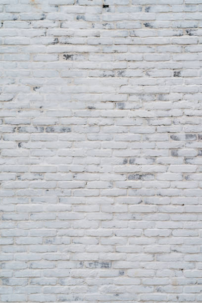 istock Brick wall wallpaper texture clinker and concrete pattern in old vintage white colour theme under the constuction area 1316225335