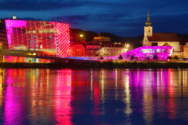 Linz at the Donau Linz at the Danube ist the Capital of Upper Austria, the Ars Electronica Center at the left side of Danube stream is one of the signs of the town. Also the castle in the back. linz austria stock pictures, royalty-free photos & images