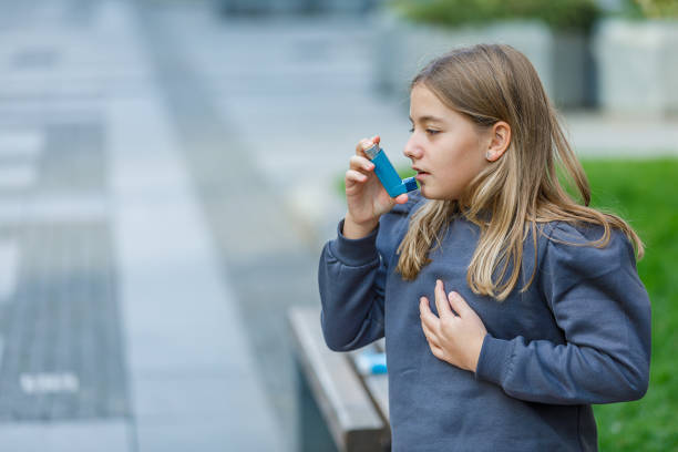 istock Cute Girl has Problems With Respiratory System so She Uses an Inhaler. 1316227733