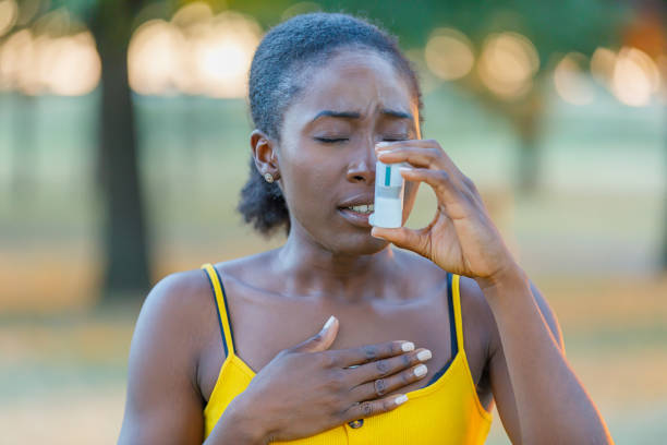 istock Young African-American Woman is Having Asthmatic Problems Outside in Nature. 1316227930