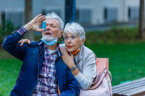 istock Ill Senior Man With Chronic Bronchitis is Using Inhaler. 1316228641