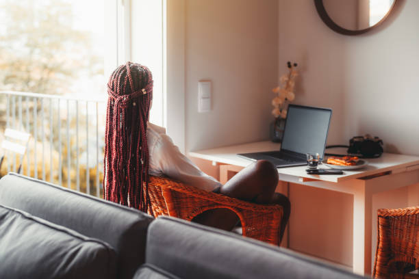 Black girl at home, view from behind