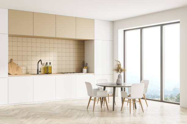 istock Modern kitchen interior, dining area with panoramic windows. Furnished by table and chairs for eating. Parquet floor. 1316230426