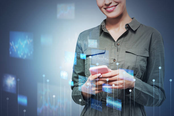 istock Smiling young woman with phone, graphs 1316230834