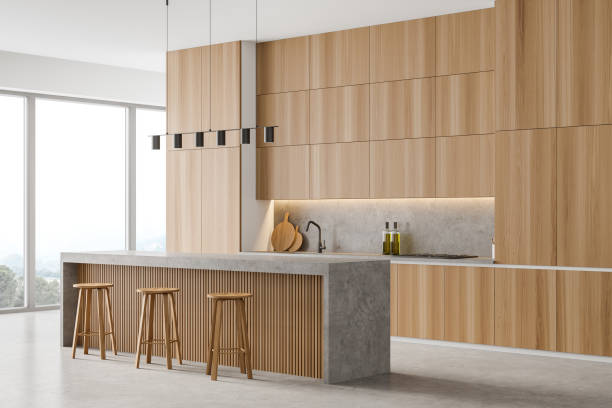 istock Wooden dining room, bar chairs and table near window 1316232764