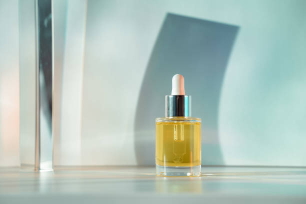 istock Yellow face oil on light green blue background 1316233601