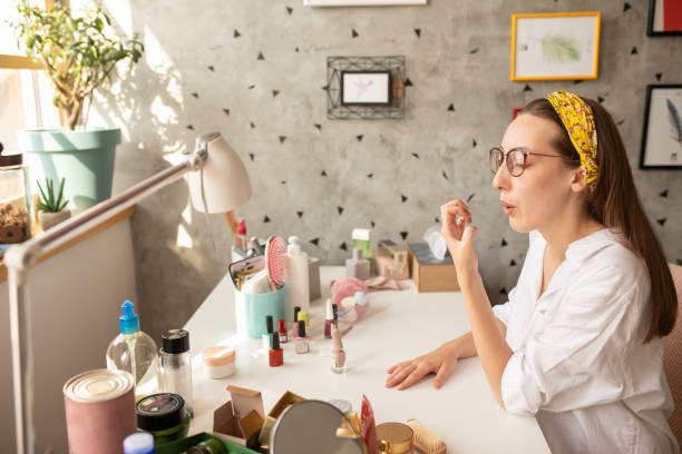 istock Young woman blowing her nails after applying nail polish 1316233633
