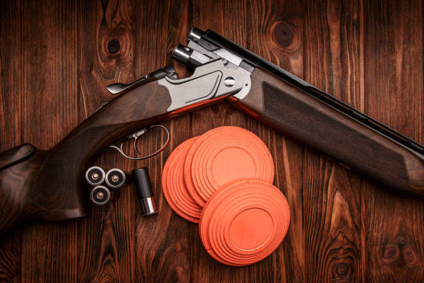 istock Clay target plates for shooting with rifle on wooden background. 1316233667