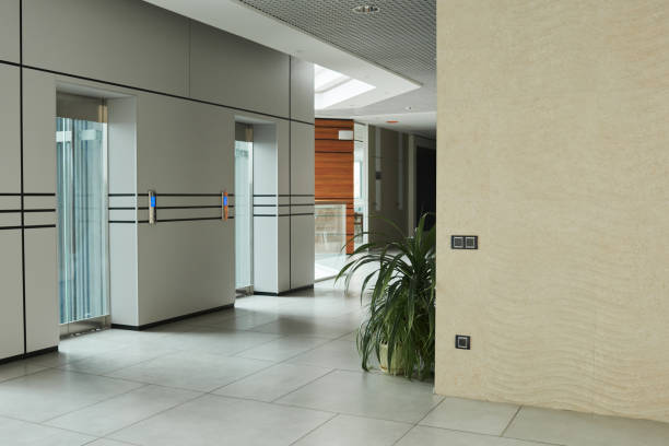 Modern corridor with elevator Image of modern corridor with elevator with glass doors in office building good condition stock pictures, royalty-free photos & images
