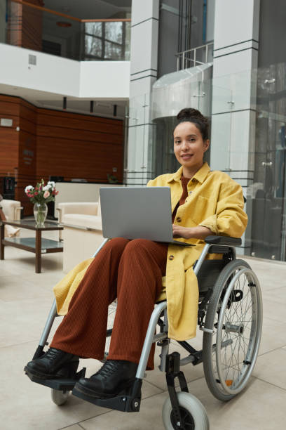 istock Disabled businesswoman working on laptop 1316234898