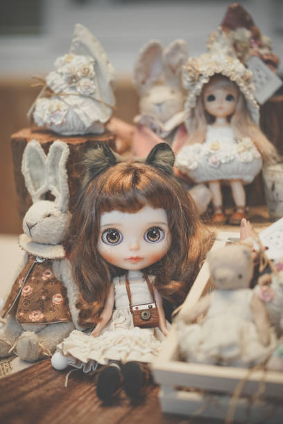 istock Vintage doll. Cute dolls on display at doll shop 1316235231