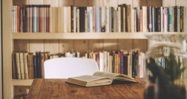 istock Empty table with open book. Cozy, welcoming  room 1316235389