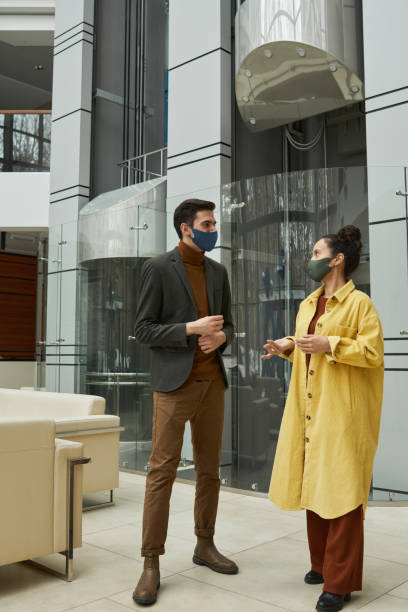 istock People talking in masks 1316235707