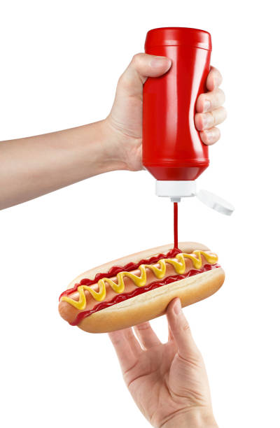 istock Delicious hot dog cooking on white 1316236467