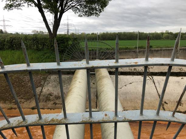 istock Pipes over a canal 1316237711