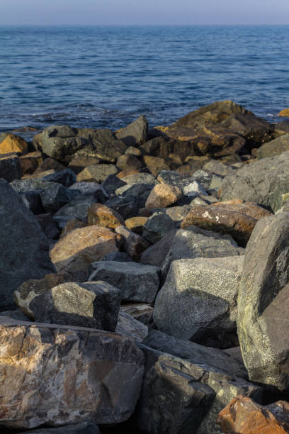 istock Rocky shoreline in warm sunlight 1316237777