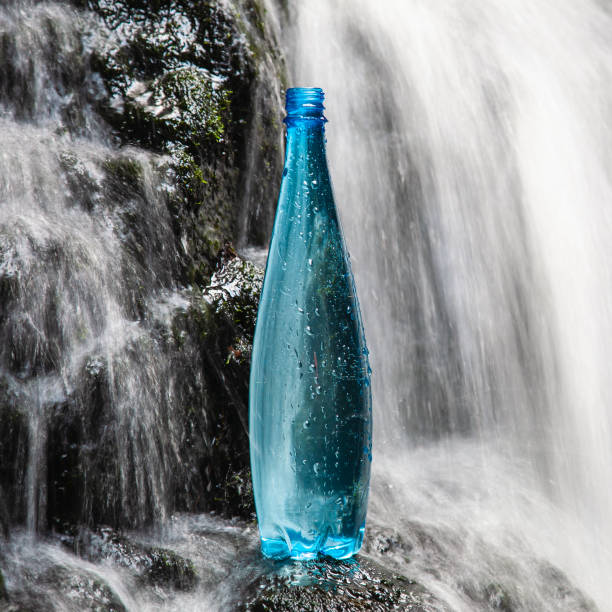 Blue bottle of mineral water stock photo