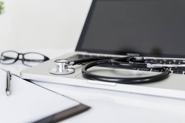 istock Stethoscope on laptop on doctor desk in office 1316237952