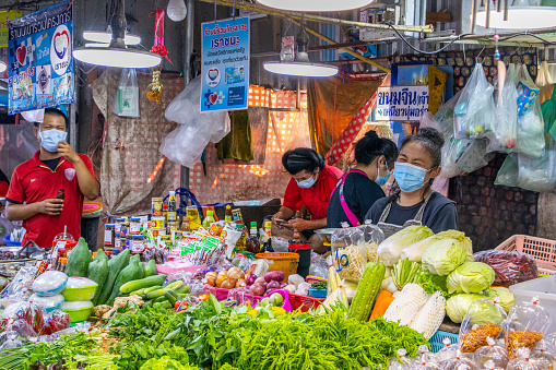 Thai sellers continue to sell food, especially freshly food, in the Thai street markets
This moment in the picture shows Thai people who are doing their job as a seller at a food market in Thailand under the current Covid pandemic. You can see the assortment that is sorted and offered for sale. Furthermore, the Thai people with masks, which are in front  This photo documents a moment of the current situation on a street market in Thailand
Pattaya District Chonburi Thailand Asia
05/03/2021