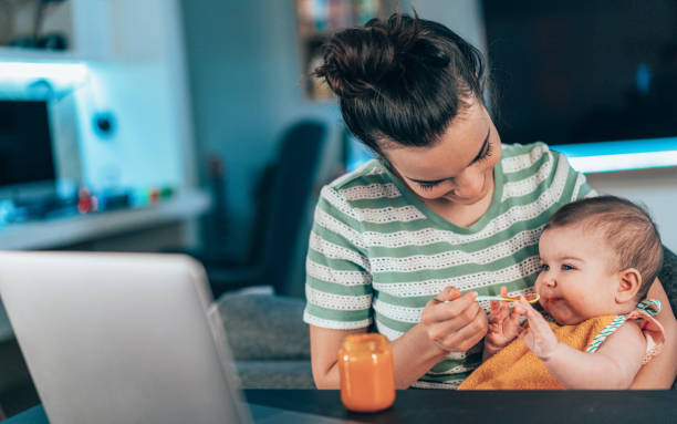 istock Mother feeding her baby 1316239431
