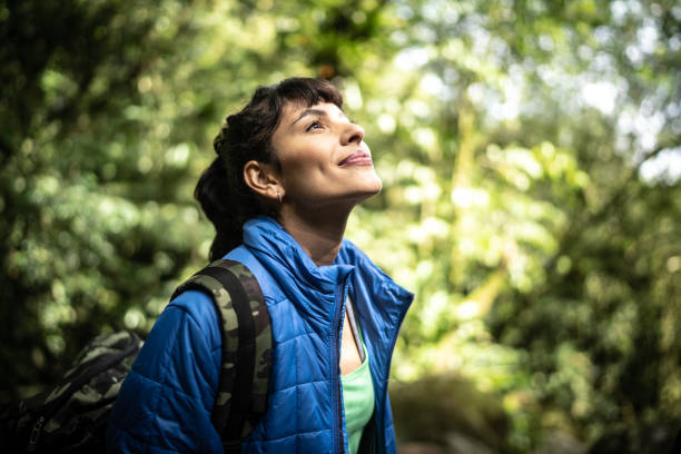 istock Young woman admining hiking in a forest 1316243315