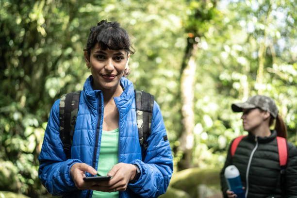 istock Portrait of a woman using smartphone in a forest 1316243386