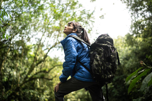 istock Young woman hiking looking up 1316243937