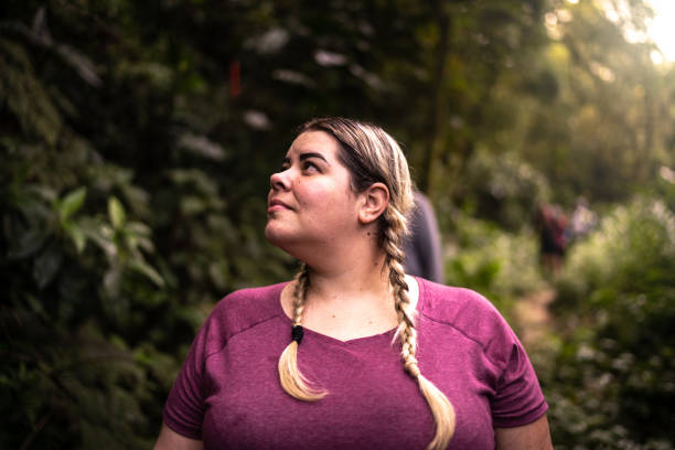 Woman admiring a forest during hiking