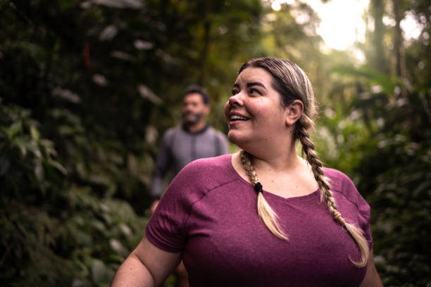 Woman admiring a forest during hiking