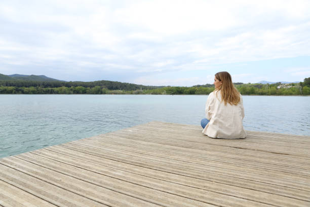 istock Woman resting contemplating views in a lake 1316244585