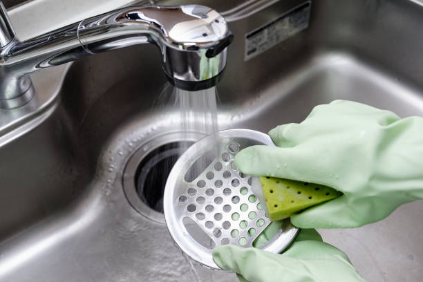 istock Women cleaning the kitchen sink 1316244590