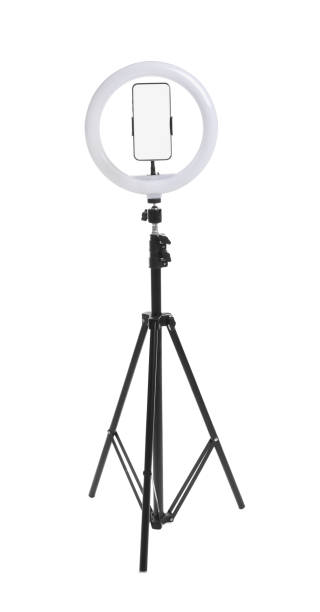 istock Modern tripod with ring light and smartphone isolated on white 1316244823