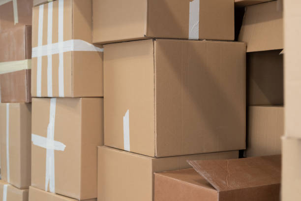 istock Stack of cardboard boxes ready to be shipped of a warehouse. Package storage room. 1316245359