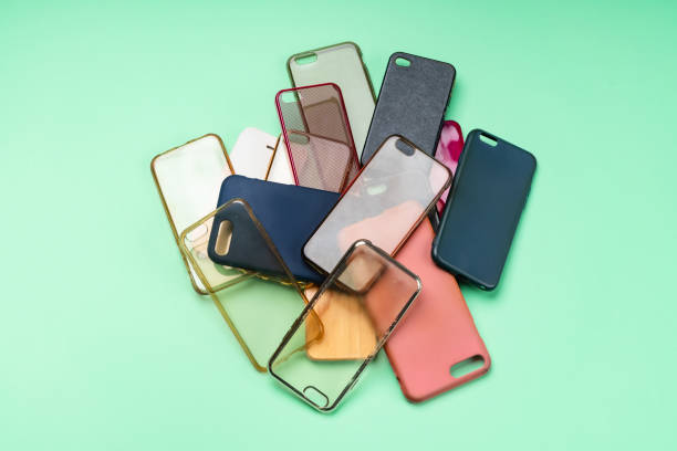 istock Pile of multicolored plastic back covers for mobile phones on green background 1316245362