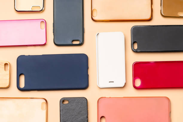 istock Pile of multicolored plastic back covers for mobile phone. Choice of smart phone protector accessories on neutral background. A lot of silicone phone backs or skins next to each other 1316245389