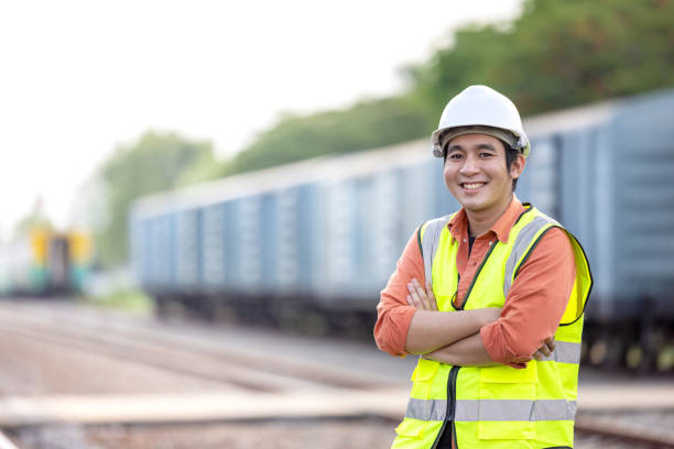 istock Portrait Engineer man working on railway. Chief Engineer in the Hard Hat in maintenance facility, Engineer and repair man concept. Safty first 1316246073