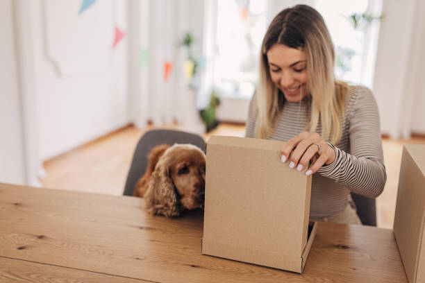 istock Woman opening a package 1316248776