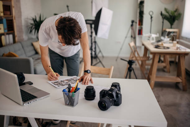 istock Man checking pictures on camera at home 1316249557