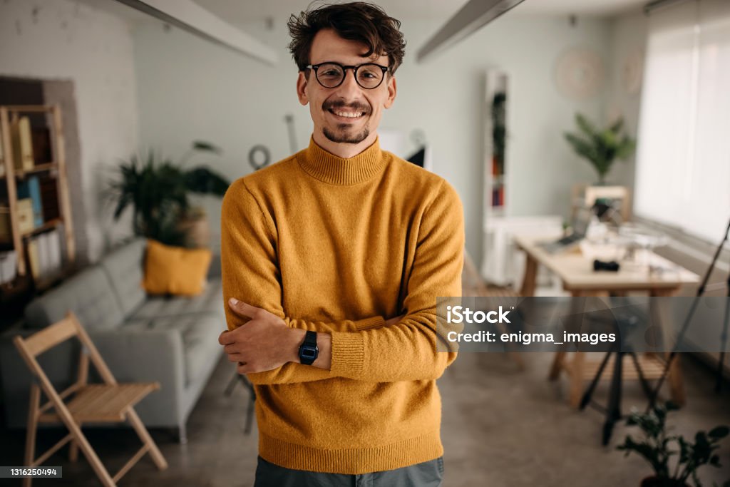 Photographer is finishing work in his office Creative Director Stock Photo